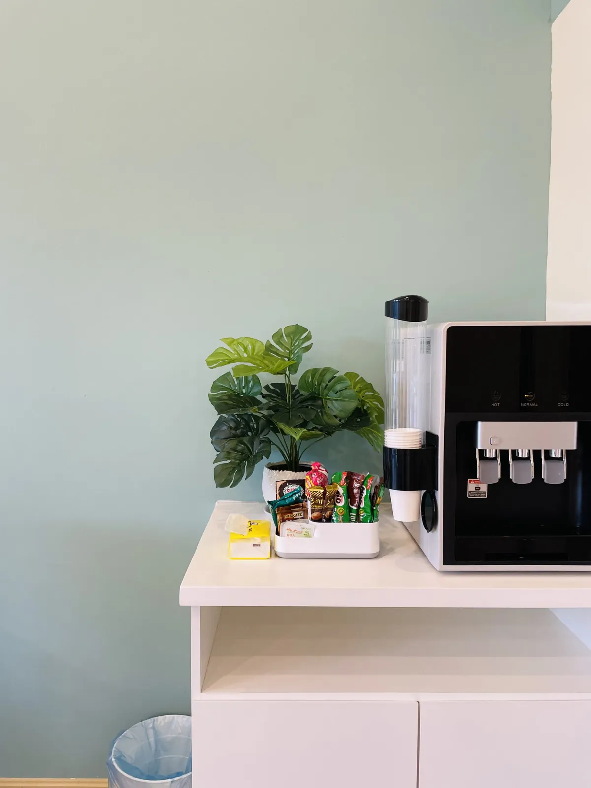 Refreshment station with water dispenser and plants